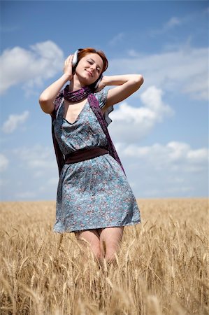 staying young - Young  smiling girl with headphones at wheat field. Stock Photo - Budget Royalty-Free & Subscription, Code: 400-04717823