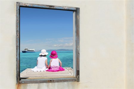 family in boat by beach - two sister girls view window sit tropical sea turquoise Formentera Stock Photo - Budget Royalty-Free & Subscription, Code: 400-04718065