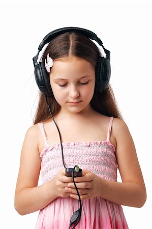 simsearch:400-05717354,k - Young girl with headphones looking at something in her mobile or player. Stock Photo - Budget Royalty-Free & Subscription, Code: 400-04719020