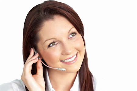 simsearch:400-05209692,k - Charming young businesswoman wearing earpiece against a white background Stock Photo - Budget Royalty-Free & Subscription, Code: 400-04719962