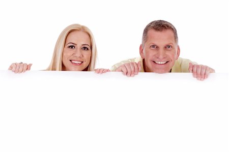 simsearch:400-04340435,k - Man and woman holding empty white board and smiling at camera Stock Photo - Budget Royalty-Free & Subscription, Code: 400-04710198