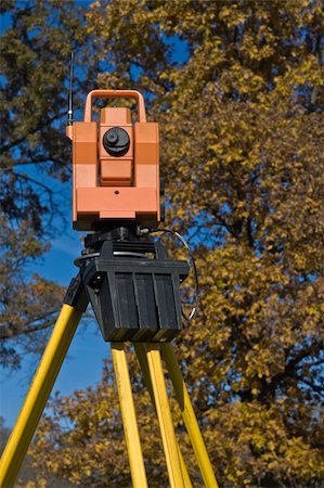 simsearch:400-04710606,k - Theodolite against a tree - fall land surveying. Stock Photo - Budget Royalty-Free & Subscription, Code: 400-04710607