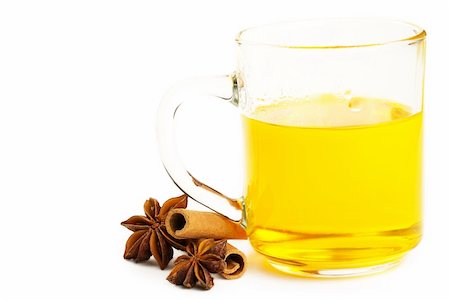 yellow tea with cinnamon sticks and star anise on white background Stock Photo - Budget Royalty-Free & Subscription, Code: 400-04711216