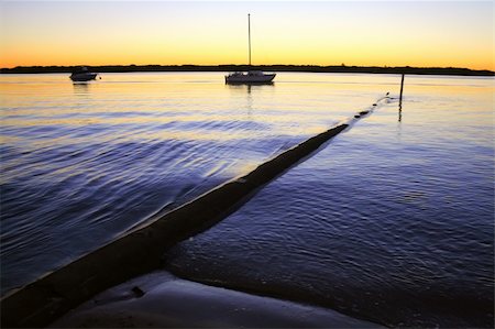 simsearch:400-05255037,k - Still blue morning over anchored boats just before dawn. Stockbilder - Microstock & Abonnement, Bildnummer: 400-04711373