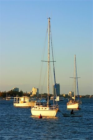 simsearch:400-05255037,k - Yachts and boats at anchor in the setting sun at the end of the day. Stock Photo - Budget Royalty-Free & Subscription, Code: 400-04711449