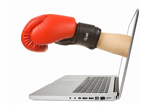 Creative picture notebook with the attacking arm with boxing gloves from the display. Studio isolation on a white background. Stock Photo - Budget Royalty-Free & Subscription, Code: 400-04711739
