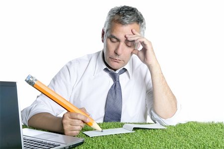 simsearch:400-04204942,k - businessman senior sign bank check pensively humor gesture big pencil green grass desk Stock Photo - Budget Royalty-Free & Subscription, Code: 400-04712105