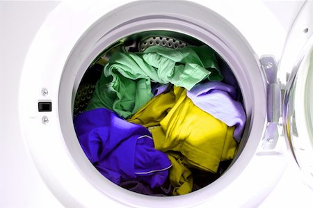 Colorful shirt and trousers in a white laundry. Foto de stock - Super Valor sin royalties y Suscripción, Código: 400-04712127