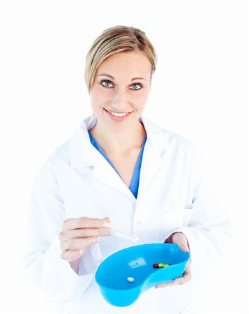 simsearch:400-05748268,k - Charismatic female doctor holding capsule against white background Stock Photo - Budget Royalty-Free & Subscription, Code: 400-04712397