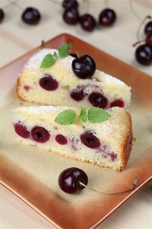 simsearch:400-04709493,k - Delicious homemade sponge cake with black cherries. Shallow DOF Stock Photo - Budget Royalty-Free & Subscription, Code: 400-04712415
