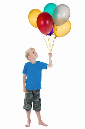 simsearch:400-04713054,k - Happy boy holding a bunch of balloons, against a white background. Photographie de stock - Aubaine LD & Abonnement, Code: 400-04713055