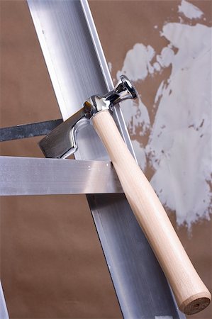 drywall - Drywall hammer on a step ladder next to a brown drywall. Stock Photo - Budget Royalty-Free & Subscription, Code: 400-04713070