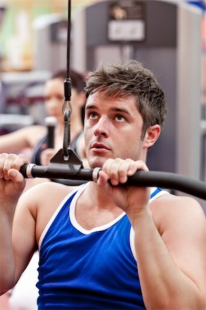 simsearch:400-04256139,k - Muscular male athlete practicing body-building in a fitness center Stock Photo - Budget Royalty-Free & Subscription, Code: 400-04724137