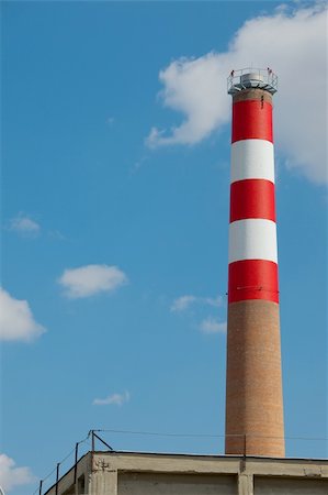 exhaust pipe - Industrial chimney against blue sky Stock Photo - Budget Royalty-Free & Subscription, Code: 400-04724198