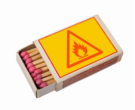 simsearch:400-04389417,k - Yellow  matchbox with hazard sign isolated on white, clipping path. Foto de stock - Super Valor sin royalties y Suscripción, Código: 400-04724211