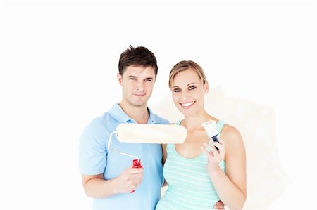 simsearch:400-04878558,k - Charming caucasian couple painting a room in their new house Stock Photo - Budget Royalty-Free & Subscription, Code: 400-04724762