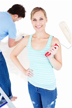 simsearch:400-04878558,k - Merry young couple painting a room in their new house Stock Photo - Budget Royalty-Free & Subscription, Code: 400-04724780