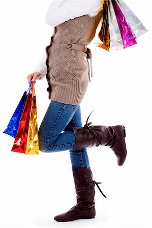 simsearch:400-04322097,k - Lower view of lady posing with shopping bags  on an isolated white background Stock Photo - Budget Royalty-Free & Subscription, Code: 400-04725239