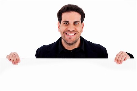 simsearch:400-05368656,k - Portrait of smiling male holding blank white card Stockbilder - Microstock & Abonnement, Bildnummer: 400-04725243