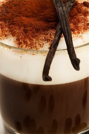 simsearch:400-06701416,k - closeup on coffee with milk froth and chocolate powder with vanilla beans on top Stock Photo - Budget Royalty-Free & Subscription, Code: 400-04725521