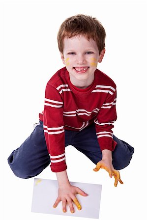 simsearch:400-03986982,k - Children playing with paint, stamping his hand on a white sheet Photographie de stock - Aubaine LD & Abonnement, Code: 400-04725896