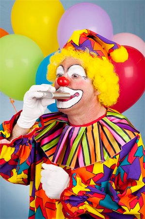 drunk man dressed up - Alcoholic clown takes a drink from his flask. Stock Photo - Budget Royalty-Free & Subscription, Code: 400-04728290