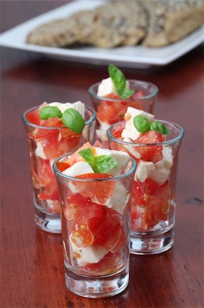 simsearch:400-08071423,k - Appetizers with tomatoes, mozzarella and basil in small glasses Foto de stock - Royalty-Free Super Valor e Assinatura, Número: 400-04728348