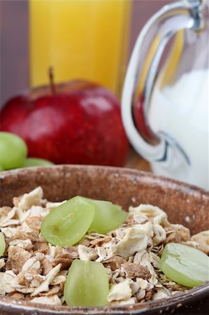 simsearch:400-05735704,k - Healthy breakfast consisting of granola, grapes, apple, orange juice and milk Photographie de stock - Aubaine LD & Abonnement, Code: 400-04728353