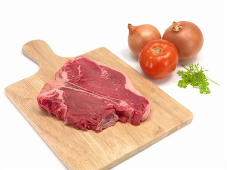 A T Bone steak isolated against a white background Stock Photo - Budget Royalty-Free & Subscription, Code: 400-04728869