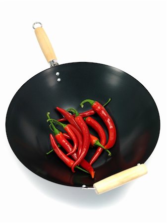 simsearch:400-05732421,k - Red chilli peppers in a wok isolated against a white background Photographie de stock - Aubaine LD & Abonnement, Code: 400-04728901