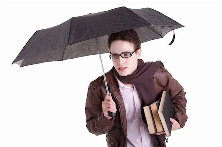 Young boy with an umbrella carrying books, isolated on white, studio shot Stock Photo - Budget Royalty-Free & Subscription, Code: 400-04729363