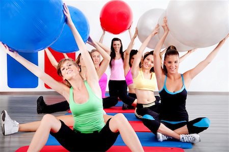 simsearch:400-04176322,k - image of people doing stretching exercise with fitness balls Stock Photo - Budget Royalty-Free & Subscription, Code: 400-04729412