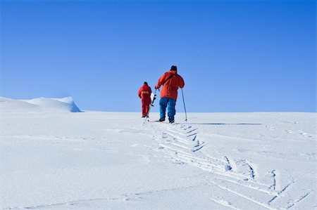 Two men are raised on a snow-covered hill Stock Photo - Budget Royalty-Free & Subscription, Code: 400-04729886