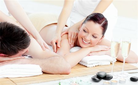Positive young couple enjoying a back massage in a spa center Stock Photo - Budget Royalty-Free & Subscription, Code: 400-04720024