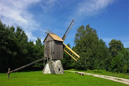 roxxer (artist) - Scenic old wooden windmill in a countryside, surrounded by a green forest. Fotografie stock - Microstock e Abbonamento, Codice: 400-04720177