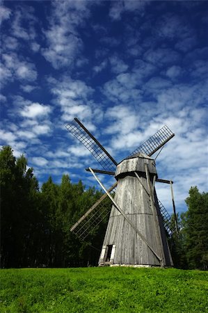 roxxer (artist) - Old windmill in a rural scene, a symbol of ancient alternative energy generation Fotografie stock - Microstock e Abbonamento, Codice: 400-04720178