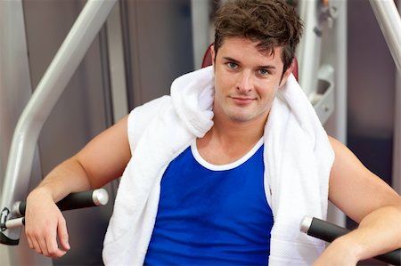 simsearch:400-05677914,k - Handsome muscular man using a bench press in a fitness center Stock Photo - Budget Royalty-Free & Subscription, Code: 400-04720172