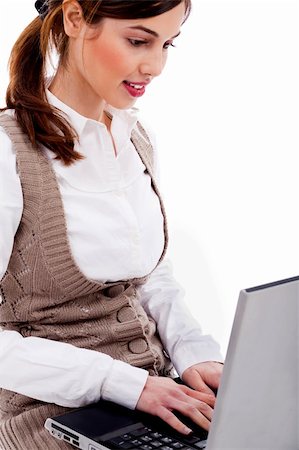 simsearch:400-05732500,k - Portrait of pretty woman working on laptop against white background Foto de stock - Royalty-Free Super Valor e Assinatura, Número: 400-04720495
