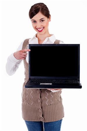 simsearch:400-05895521,k - portrait of woman holding laptop and pointing  at it against an isolated background Stock Photo - Budget Royalty-Free & Subscription, Code: 400-04720493