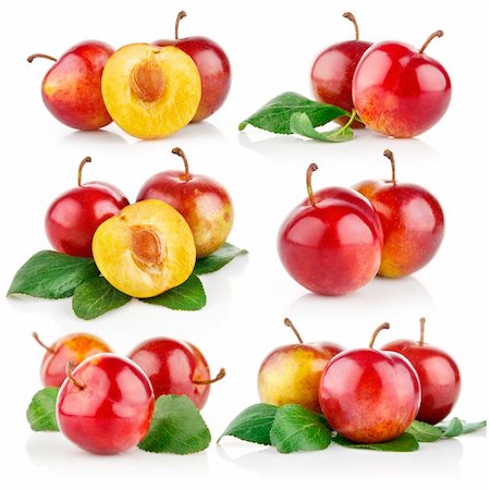 simsearch:400-04164071,k - set plum fruits with cut and green leaves isolated on white background Stock Photo - Budget Royalty-Free & Subscription, Code: 400-04720657