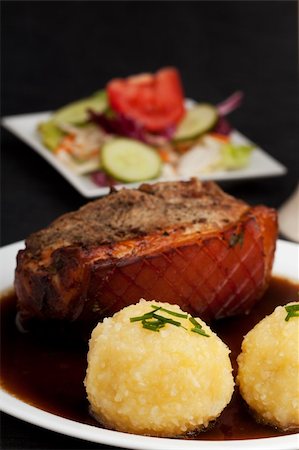 pig roast - bavarian roast pork dish with potato dumplings Stock Photo - Budget Royalty-Free & Subscription, Code: 400-04720827