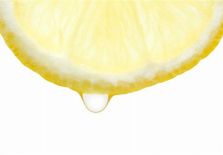 A slice of lemon with water drop Stockbilder - Microstock & Abonnement, Bildnummer: 400-04720932