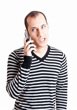 Young man talking on cellphone and worried with something, isolated on white background Stock Photo - Budget Royalty-Free & Subscription, Code: 400-04721587