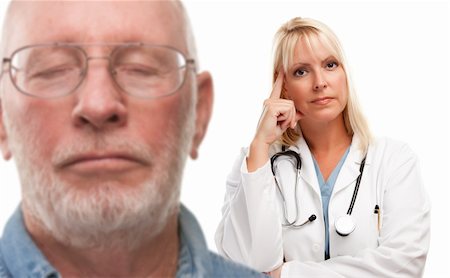 Concerned Senior Man and Female Doctor Behind with Selective Focus the Doctor. Stock Photo - Budget Royalty-Free & Subscription, Code: 400-04721795