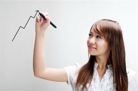 simsearch:400-06071603,k - Closeup of young Asian business woman drawing graph on transparent glass or foil. Foto de stock - Super Valor sin royalties y Suscripción, Código: 400-04722003