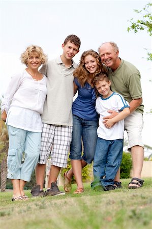 simsearch:400-04216383,k - Full length portrait of a happy family standing outdoor Foto de stock - Royalty-Free Super Valor e Assinatura, Número: 400-04722756