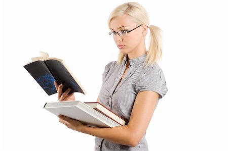 simsearch:400-06517383,k - young and beautiful teacher with glasses reading a book Fotografie stock - Microstock e Abbonamento, Codice: 400-04723237