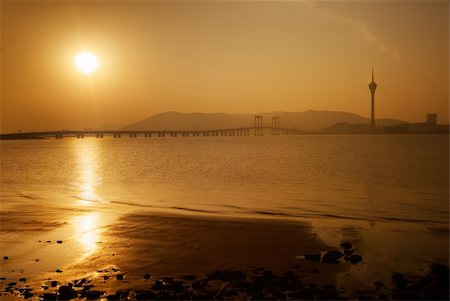 simsearch:400-05258481,k - Beautiful sunset city skyline with famous traveling tower and bridge over river in Macao, China. Stockbilder - Microstock & Abonnement, Bildnummer: 400-04723259