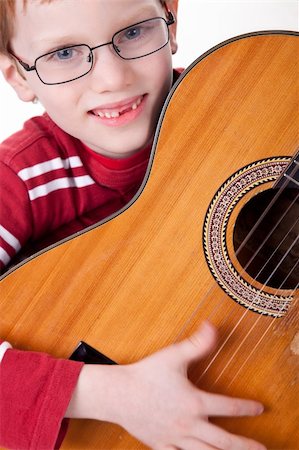 simsearch:400-04152181,k - Cute boy with a guitar, isolated on a white background Stock Photo - Budget Royalty-Free & Subscription, Code: 400-04723284