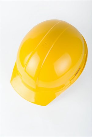 simsearch:400-04429200,k - Yellow helmet closeup on a white background Stock Photo - Budget Royalty-Free & Subscription, Code: 400-04723509